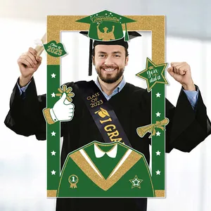 Close-up of Class of 2025 graduation photo frame prop with green and gold glitter details