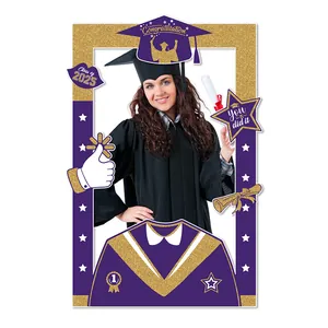 Detail of 2025 graduation photo frame prop in purple and gold with glitter accents