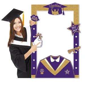 Detail of Class of 2025 graduation photo frame prop in purple and gold glitter with motifs