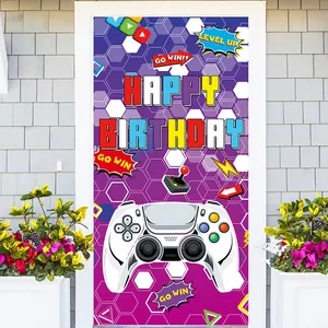 Detail of video game birthday door banner with controller icons on a white door