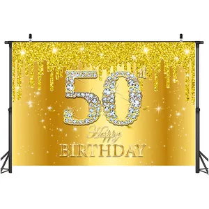 Detail view of gold 50th birthday party backdrop with sparkling diamond effect texture
