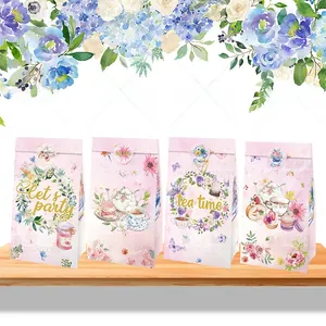 Detail of four floral tea party gift bags with watercolor flower and macaron patterns