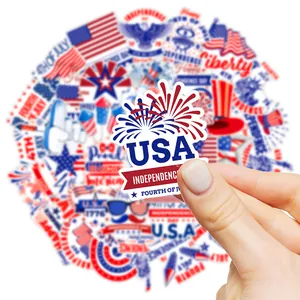 Hand holding Independence Day stickers featuring USA flag and firework patterns