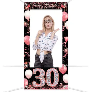 Close-up of a 30th Birthday photo booth frame banner with pink glitter and crown details