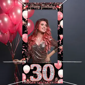 Macro view of rose gold 30th birthday photo booth frame with balloons and crown