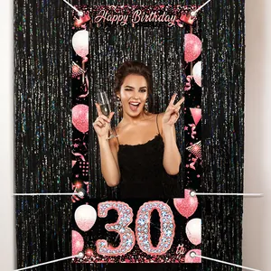 Rose gold 30th birthday photo booth frame with balloons and Happy Birthday banner