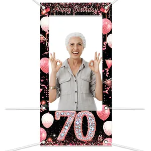 Macro detail of 70th Happy Birthday photo booth banner backdrop with rose gold glitters