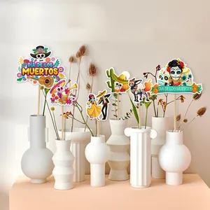 Colorful Day of the Dead centerpieces with sugar skulls and floral patterns for party decor