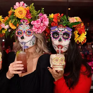 Day of the Dead party accessories set featuring floral headbands and skull paper glasses