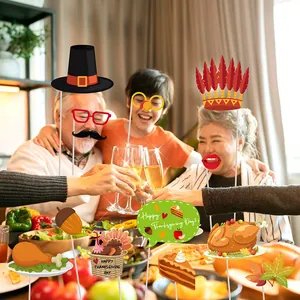 Thanksgiving party photo booth props kit featuring turkey, pumpkin and maple leaf designs