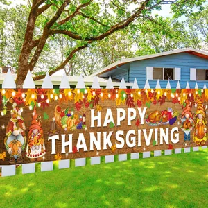 Happy Thanksgiving outdoor banner with gnomes and maple leaves on white garden fence