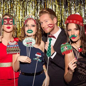 Ugly sweater Christmas party photo booth props with festive hats and glasses