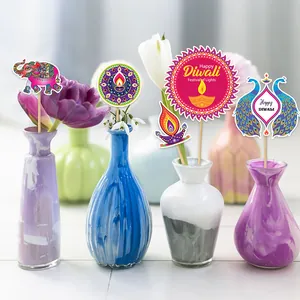 Colorful Diwali festival table decorations with paper mandalas, elephants and diya lamps