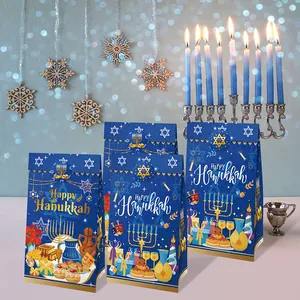 Detailed view of blue Hanukkah paper gift bags with golden Menorah and Star of David