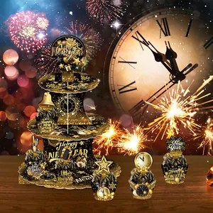 Three-tier black and gold Happy New Year cupcake stand with festive toppers and wrappers