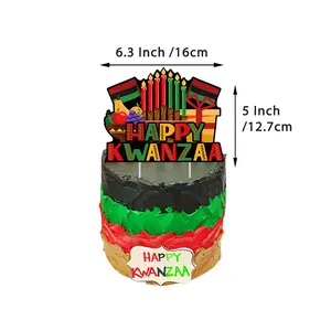 Kwanzaa cake topper set with kinara and gift motifs on a red and green tiered cake