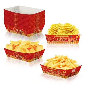 Detail of red Chinese New Year paper snack trays with gold dragon and Fu character