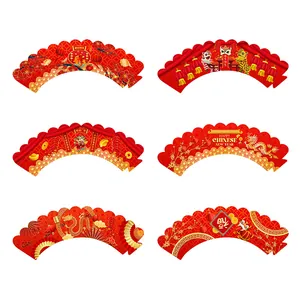 Detailed view of Chinese New Year cupcake wrappers with gold dragon and lion patterns