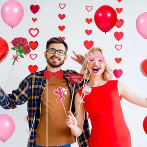 Valentine's Day photo booth props set featuring heart signs and romantic party accessories