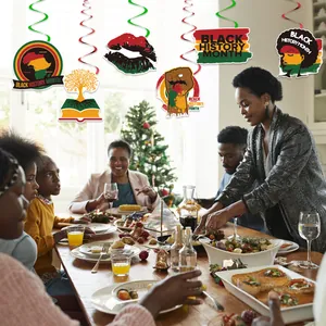 Black History Month party decorations featuring pan-African colors and spiral hanging swirls