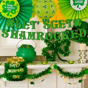 St. Patrick's Day party decor set with green glitter shamrocks and festive banner
