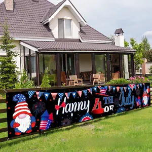 Outdoor Independence Day banner with Happy 4th of July text on a wooden garden fence