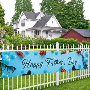 Outdoor Father's Day party banner with blue festive icons tied to a white garden fence