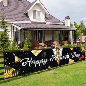 Outdoor Father's Day banner with gold tie and suit design hanging on garden fence