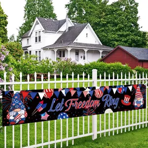 Detail of Independence Day banner on white fence featuring gnome and Let Freedom Ring text
