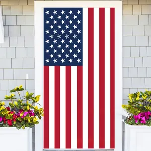 Detail of USA flag door banner with stars and stripes hanging on a white front door