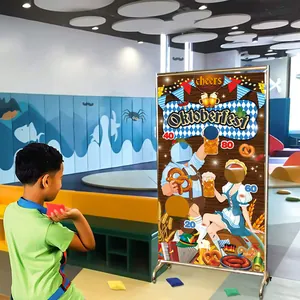 Kids Oktoberfest bean bag toss game with Bavaria themed banner and scoring holes