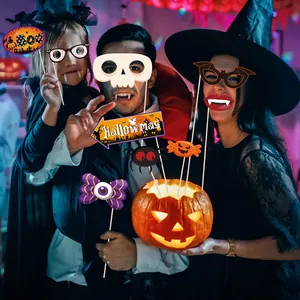 Halloween photo booth props kit with skull masks and pumpkin glasses for holiday party