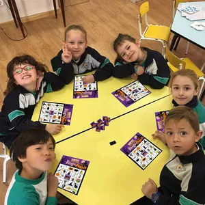 Halloween bingo game cards for kids party featuring colorful spooky festive patterns