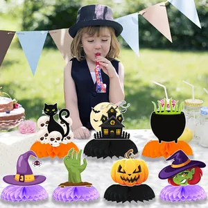 Halloween table decorations featuring black cat pumpkin and honeycomb paper bases set