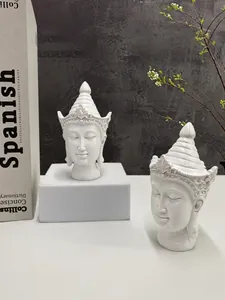 Minimalist white resin Buddha head statues on pedestals for zen home decor setup