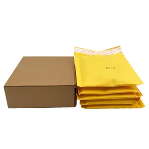 Corrugated brown cardboard box with yellow bubble mailers for photo frame packaging