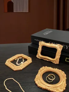 Three-piece vintage gold miniature resin photo frames with baroque floral relief patterns