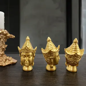 Three-view set of golden resin Buddha head statues for Southeast Asian home decor