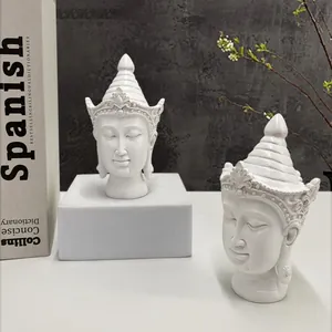White resin Buddha head statues with ornate crowns for home zen decor settings