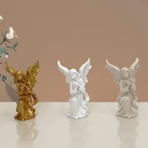 Three praying angel girl resin figurines in gold, white, and grey for home Christmas decor