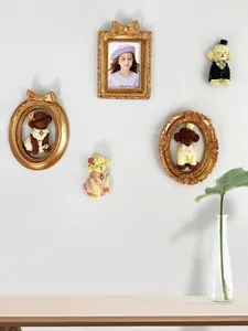 Five-piece European gold resin set with vintage picture frames and poodle figurines