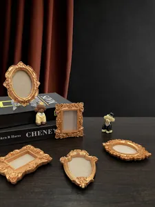 Five assorted miniature baroque resin frames in antique gold finish for DIY crafts