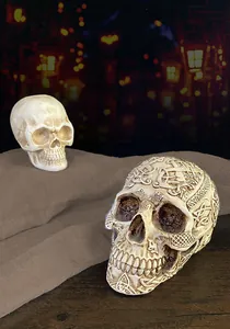 Close-up of resin skull with intricate Celtic knot carvings for Halloween bar decor