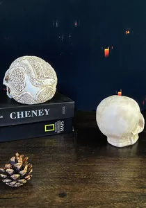 Detailed view of resin skulls with Celtic knot carvings and realistic bone textures