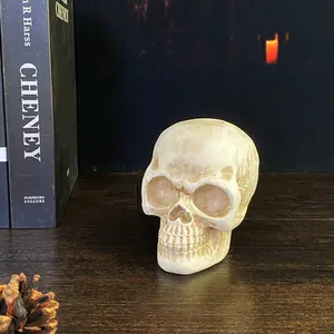 Nordic Halloween skull resin ornament with vintage ivory bone texture on wooden table