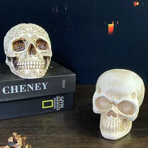 Nordic Halloween resin skull ornaments with Celtic vine carvings on vintage books