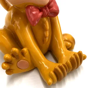 Close-up of the smooth resin monkey phone stand showing its colorful body details