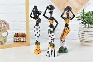 Detailed hand-painted patterns and giraffe motifs on African tribal resin figurines