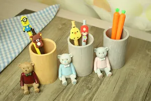 Macro detail of cute cartoon bear pen holder with wood texture finish on a desk