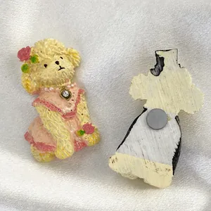 Detail of cute resin poodle fridge magnet showing both front design and back magnetic disc